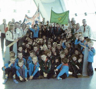 A group of Scouts sit on the glass floor of the Spinnaker Tower in Portsmouth