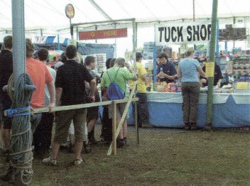 A group of Scouts queue for the camp tuck shop.