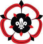 The old logo of Hampshire Scouts with a fleur de lis inside a double red and white rose design.