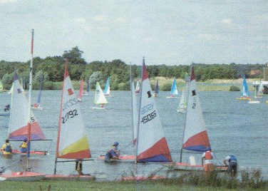 A number of sailing boats on a large lake.